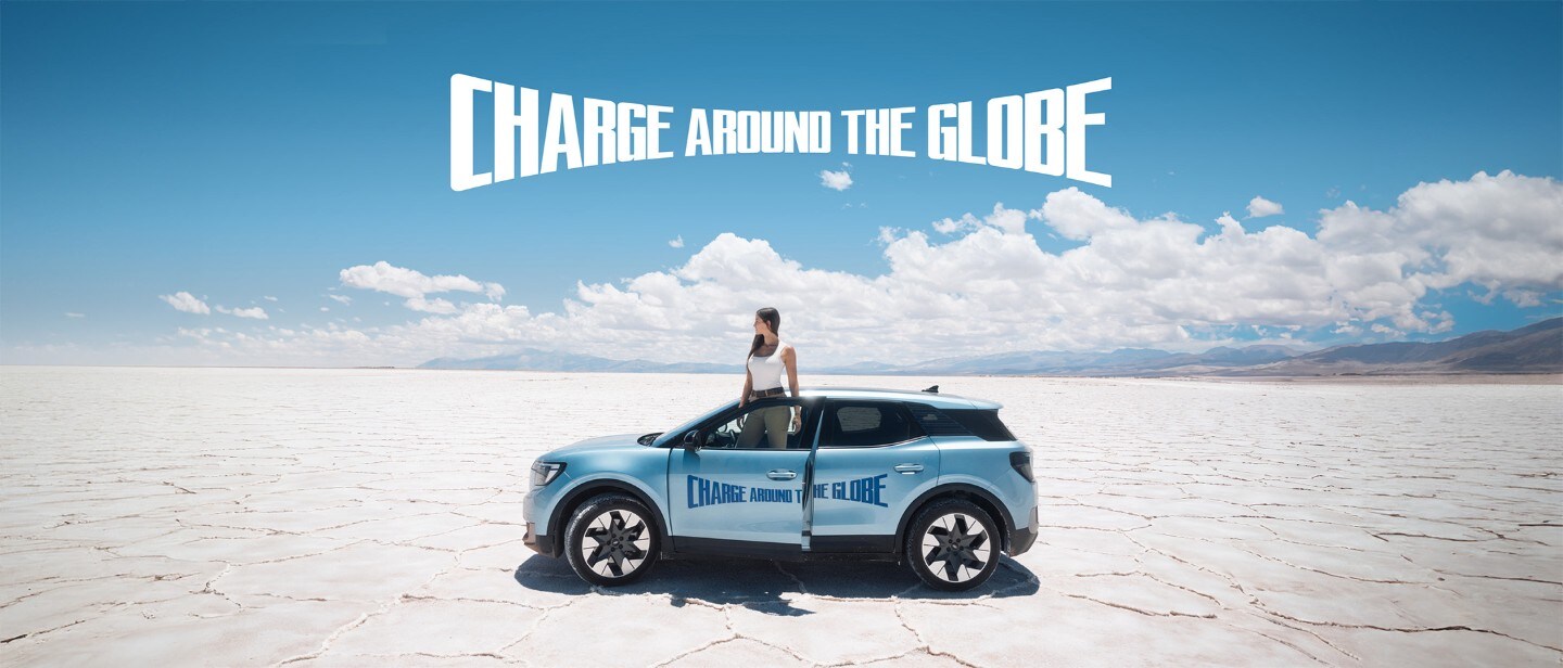 Lexie Alford, aka @LexieLimitless, stood with the Ford Explorer at the Charge Around The Globe finish line.