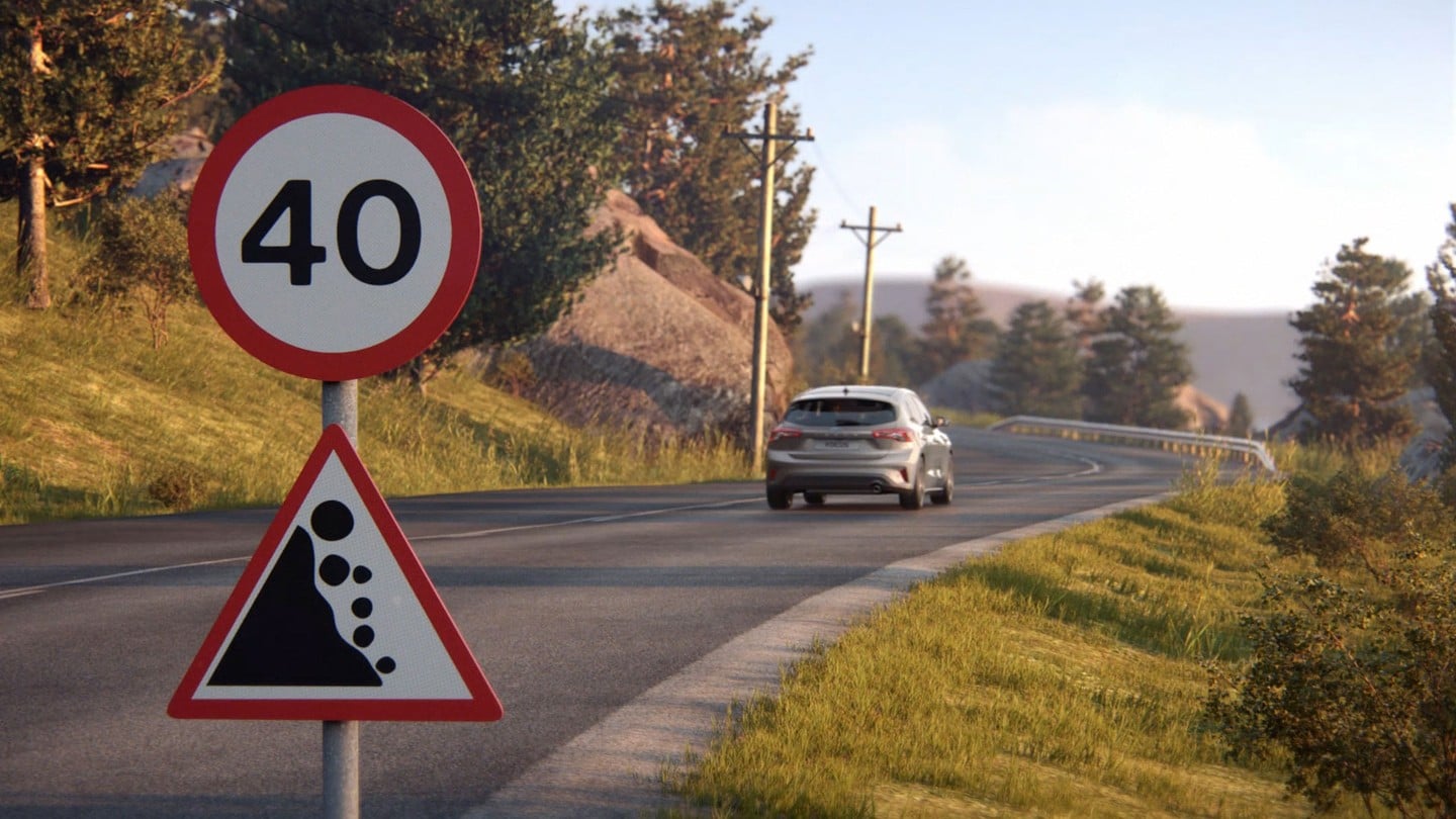 Ford Focus passing traffic signs on a country road