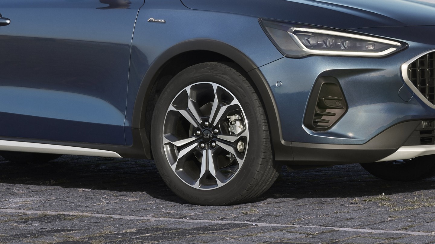 Left front wheel of a blue Ford Focus