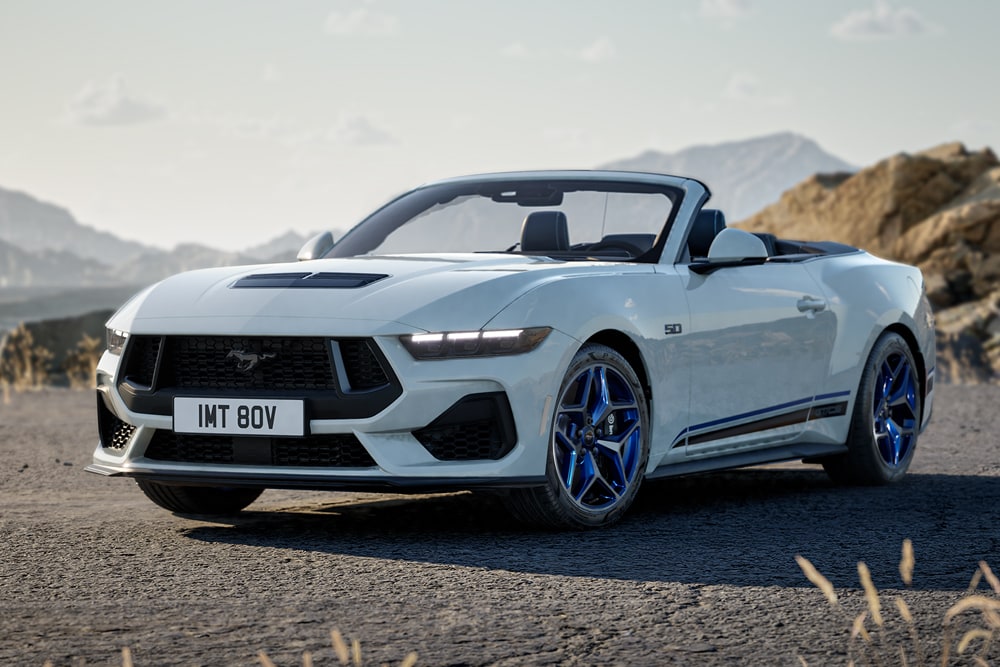 A Ford Mustang GT Convertible California Special in Oxford White paint parked on a mountain road.