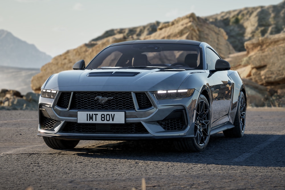 A Ford Mustang GT Fastback Nite Pony Coupe in Carbonised Grey paint parked on a mountain road.