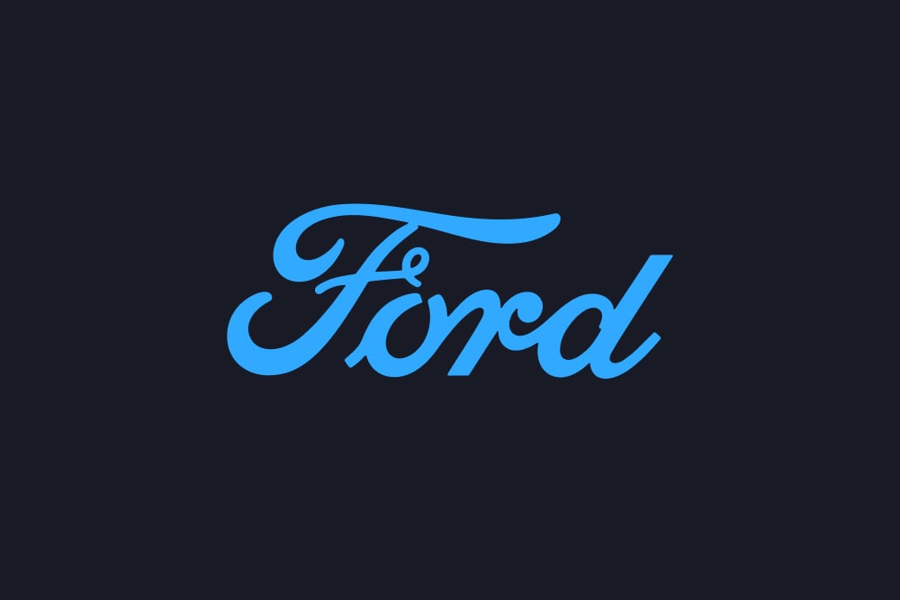 Logo albastru Ford de tip text pe fundal întunecat.
