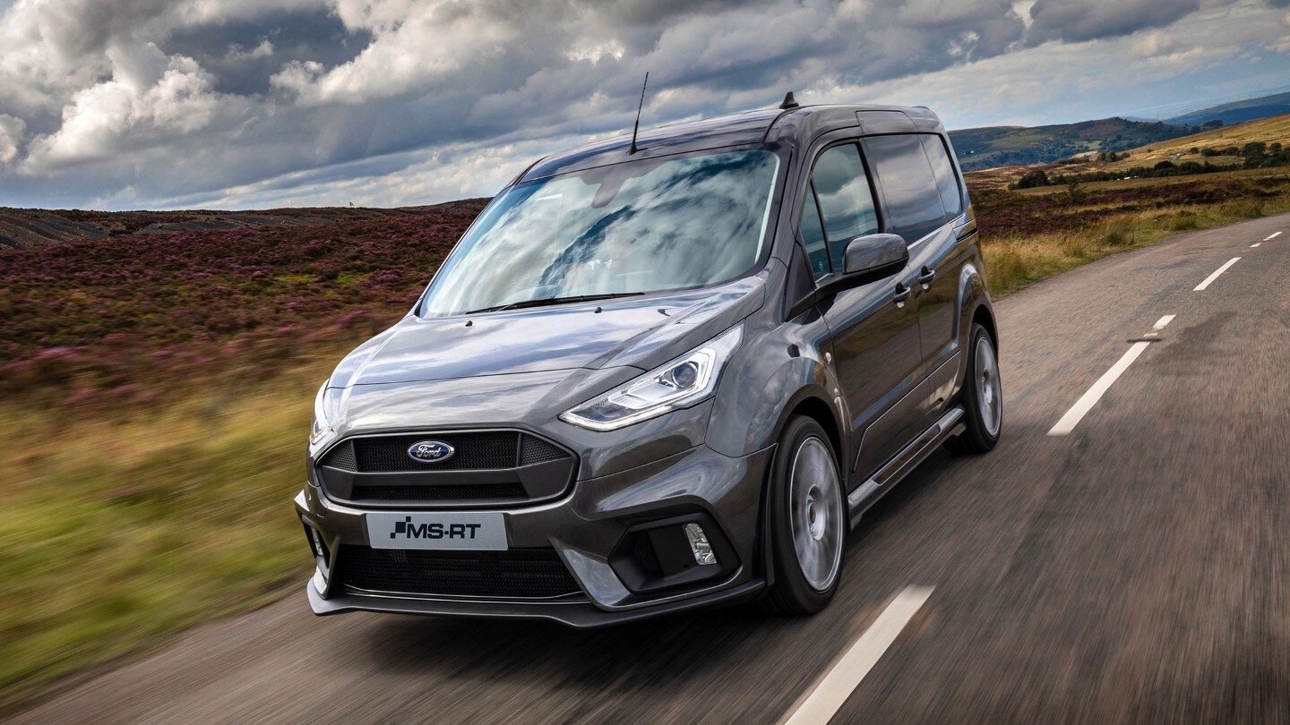 Ford Transit Connect driving at night rear view