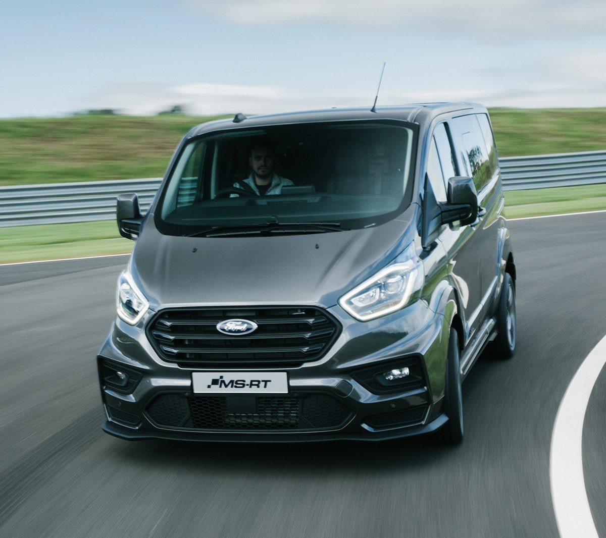 Ford Transit Custom MS-RT driving around a race track