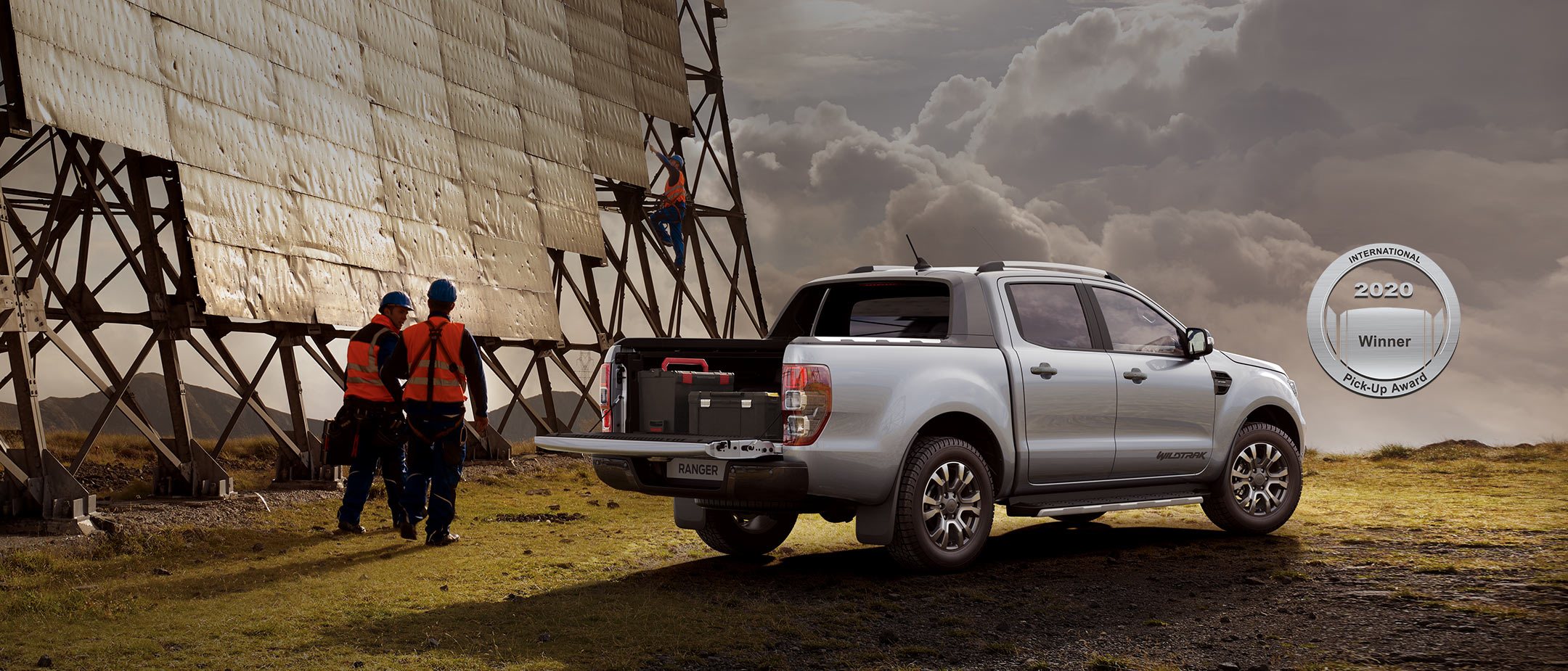 Silver Ford Ranger Wildtrak truck bed open parked near solar panels