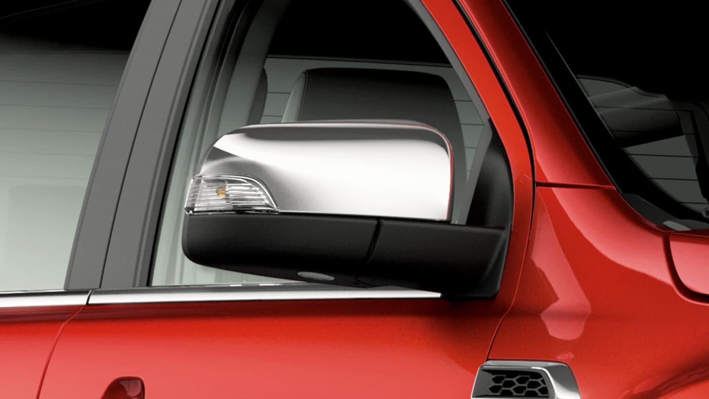 Red Ford Ranger exterior door mirror close up