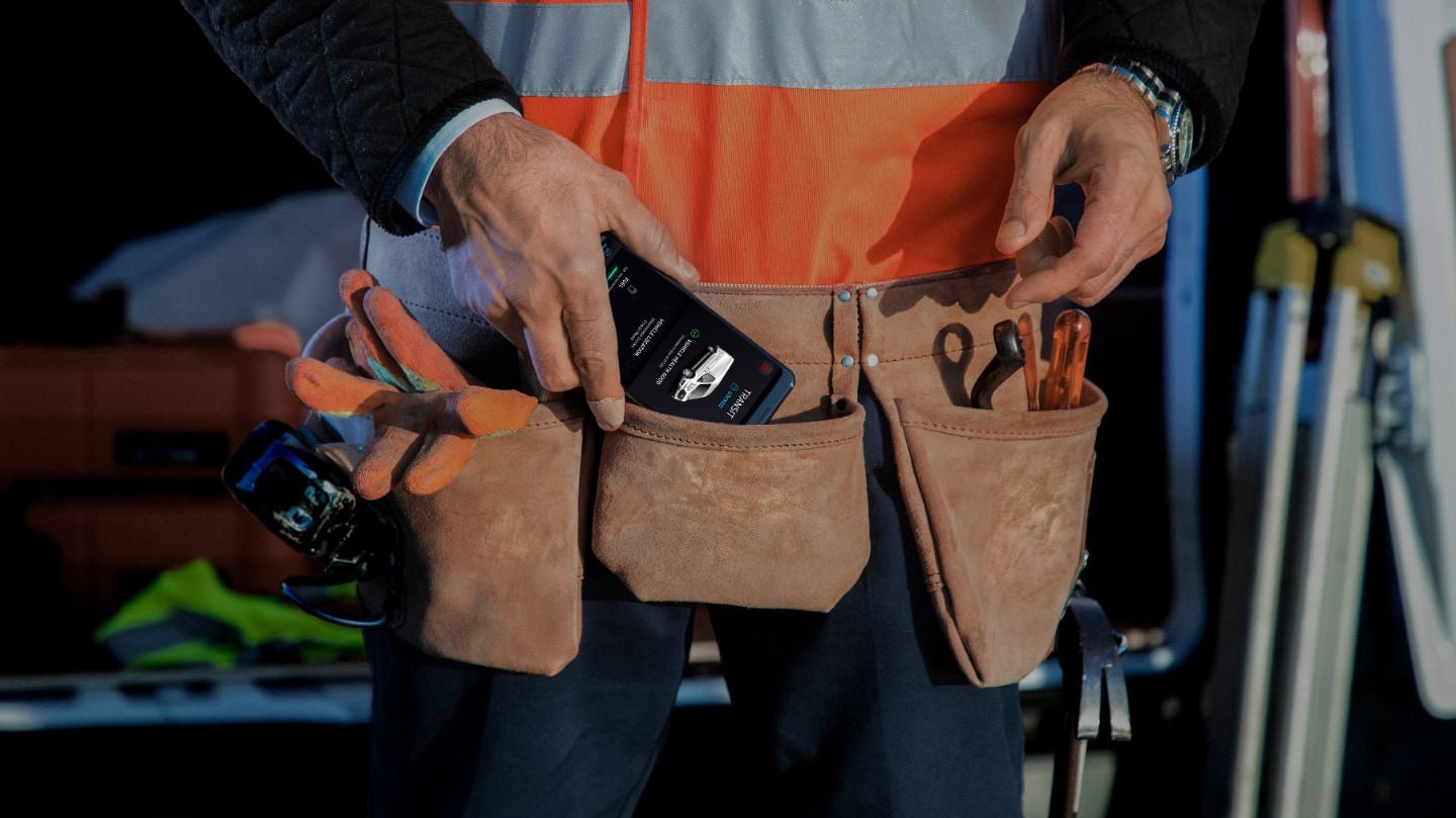 Construction worker holding a phone