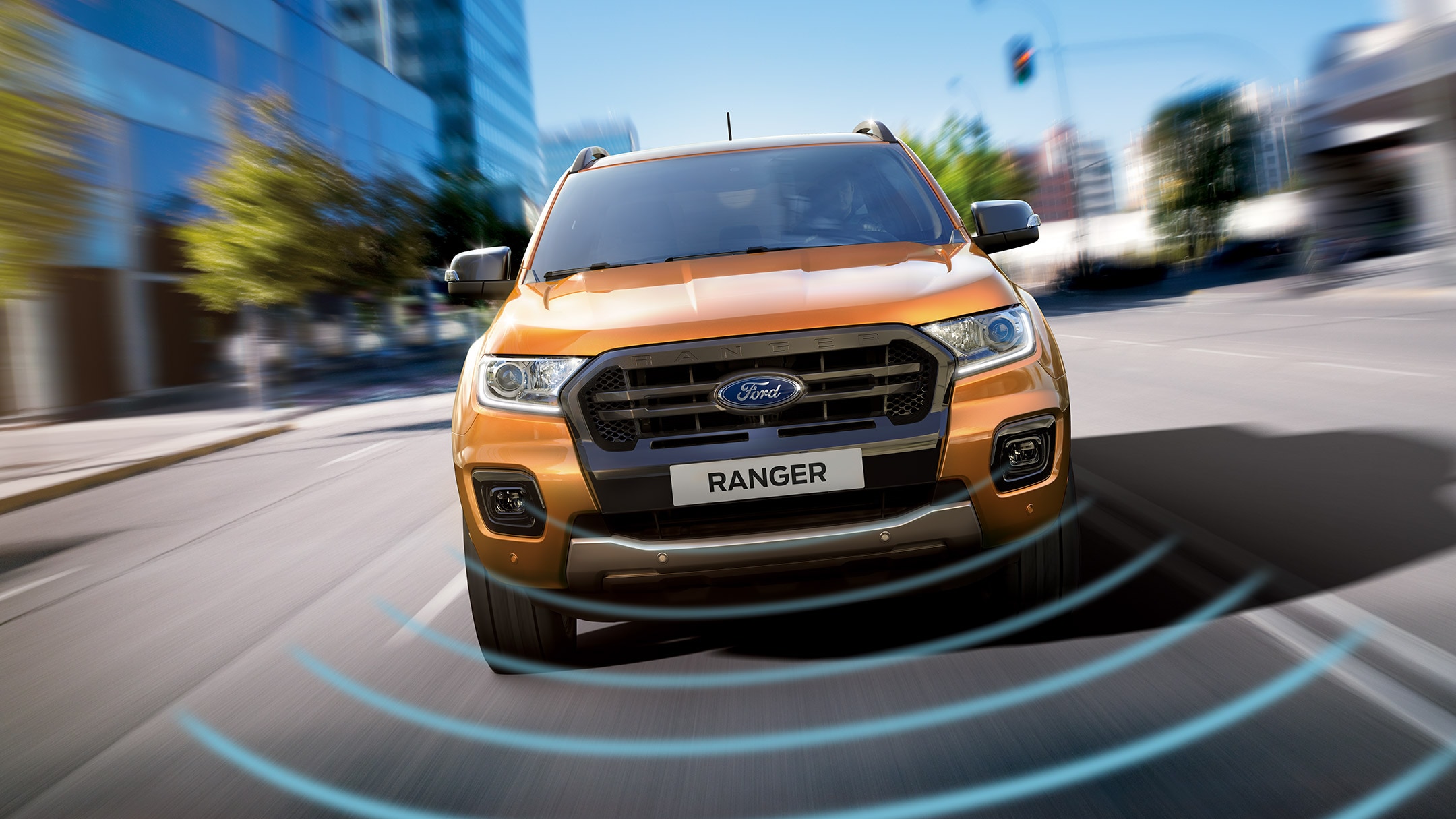 Orange Ford Ranger front view with lane keeping graphic