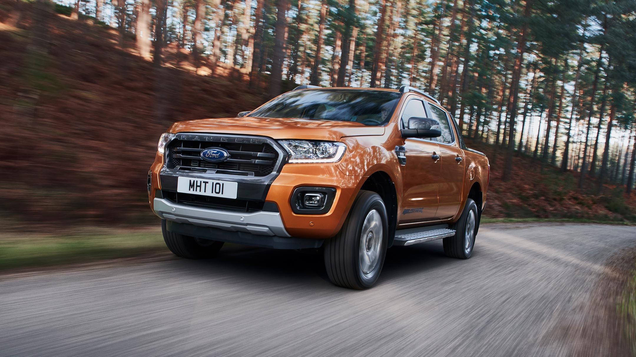 Orange Ford Ranger front view in woodlands