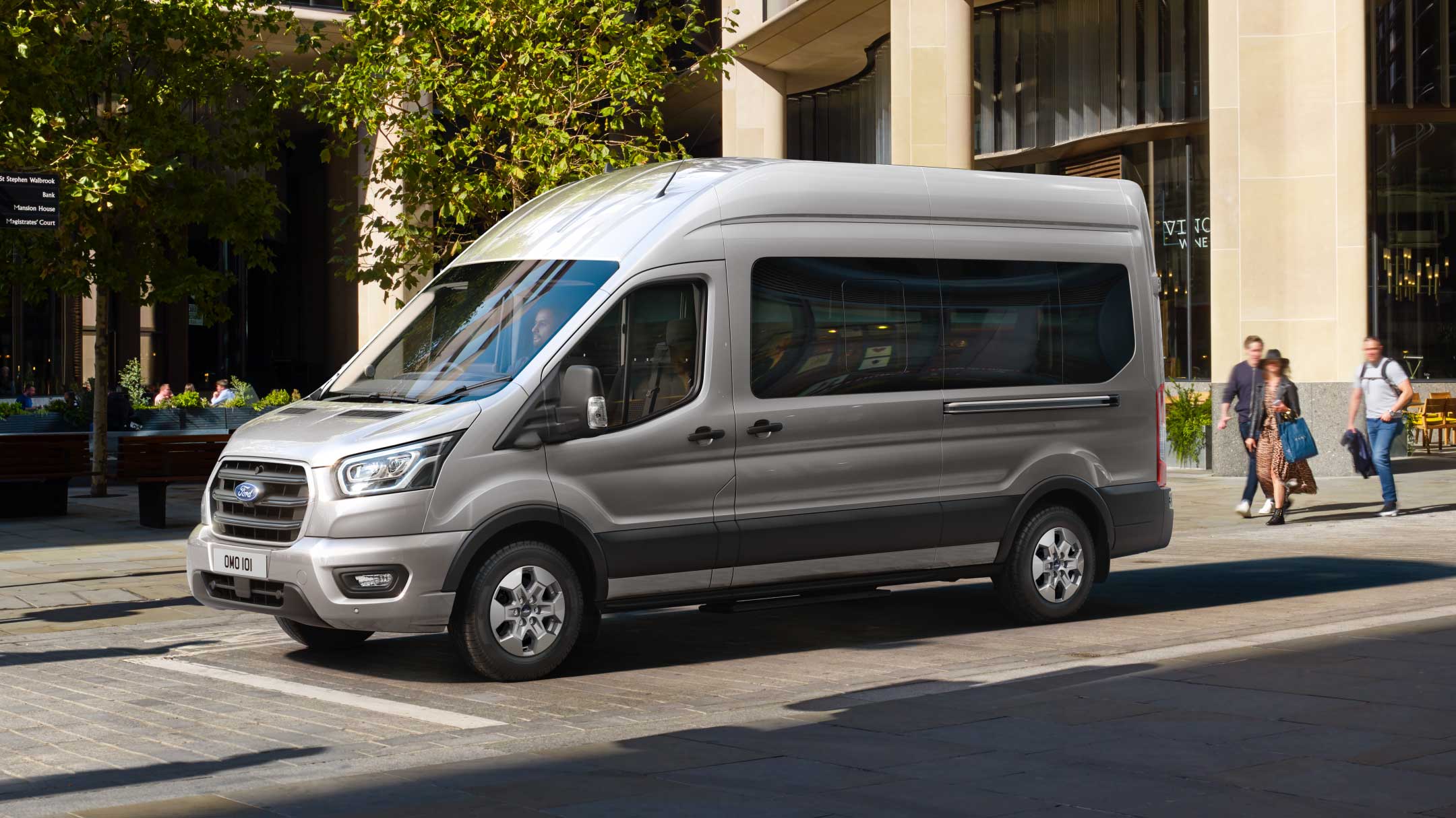 New Ford Transit Minibus standing on a busy street