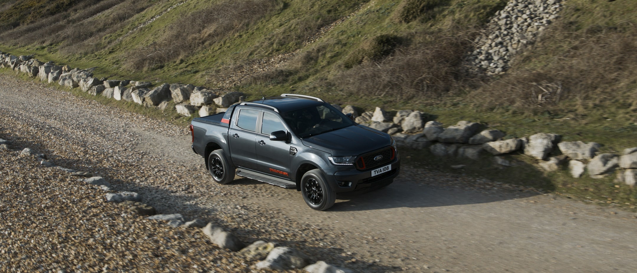 Ford Ranger Thunder driving on dirt road Ford Ranger Thunder driving on dirt road