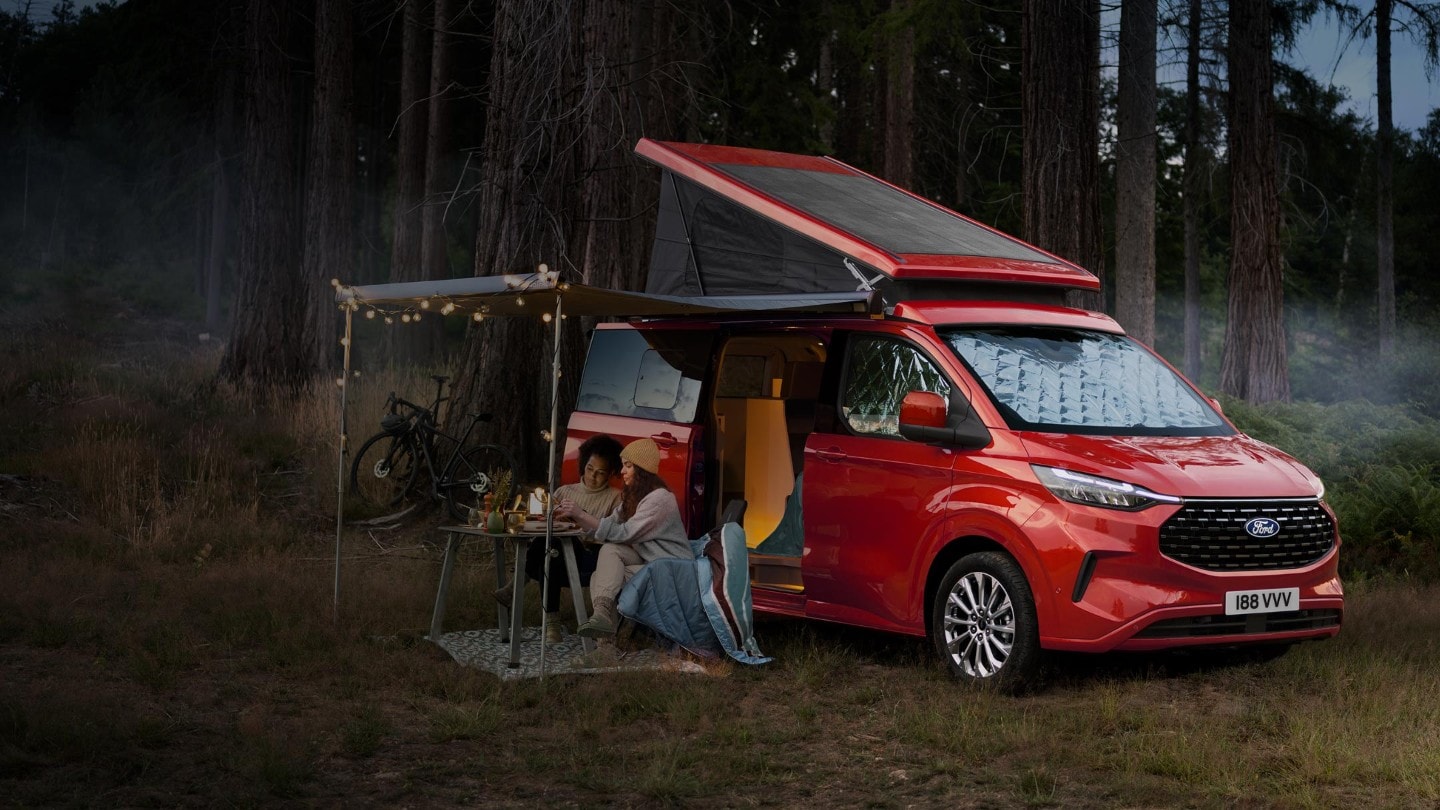 All-New Ford Transit Custom Nugget in forest with people camping