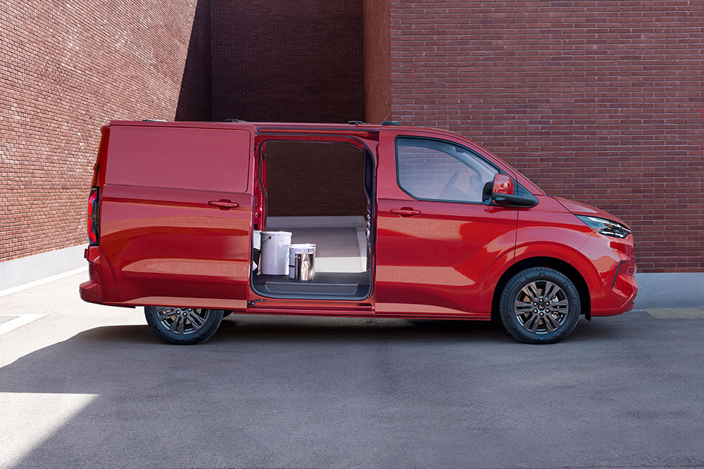 Red Ford Transit Custom van with open doors, showing interior.