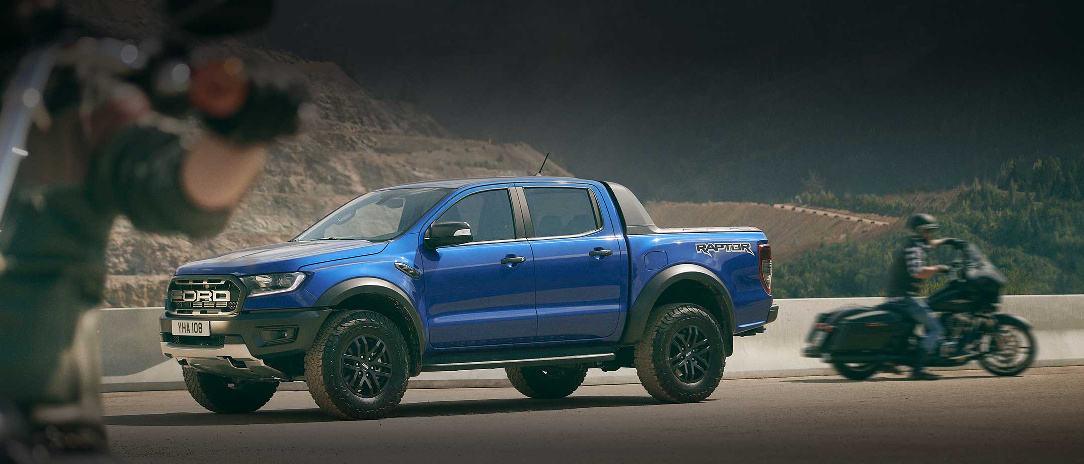 Blue Ford Ranger Raptor parked, profile view