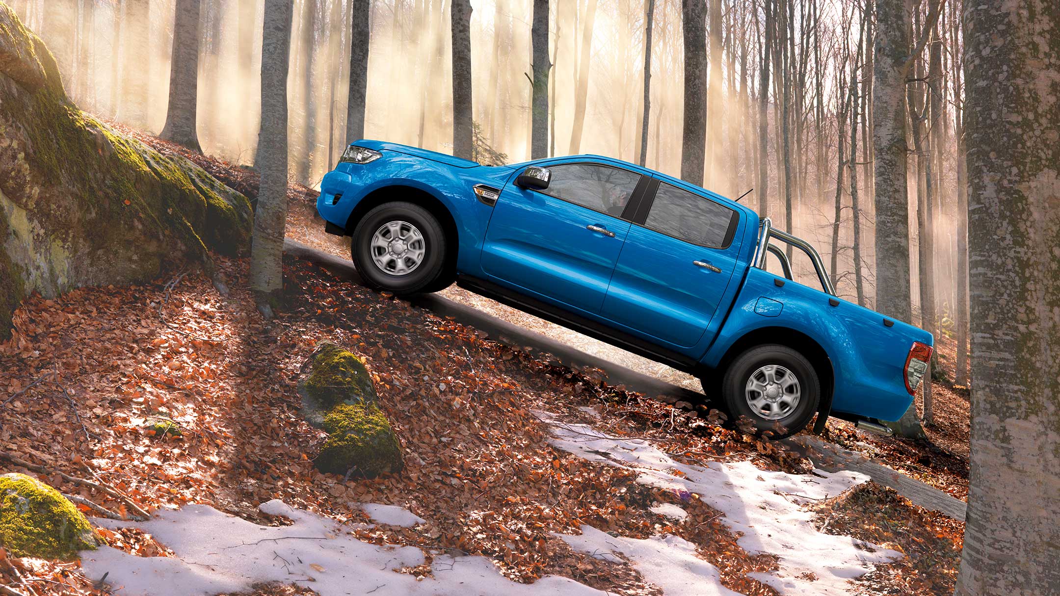 Blue Ford Ranger ascending off road