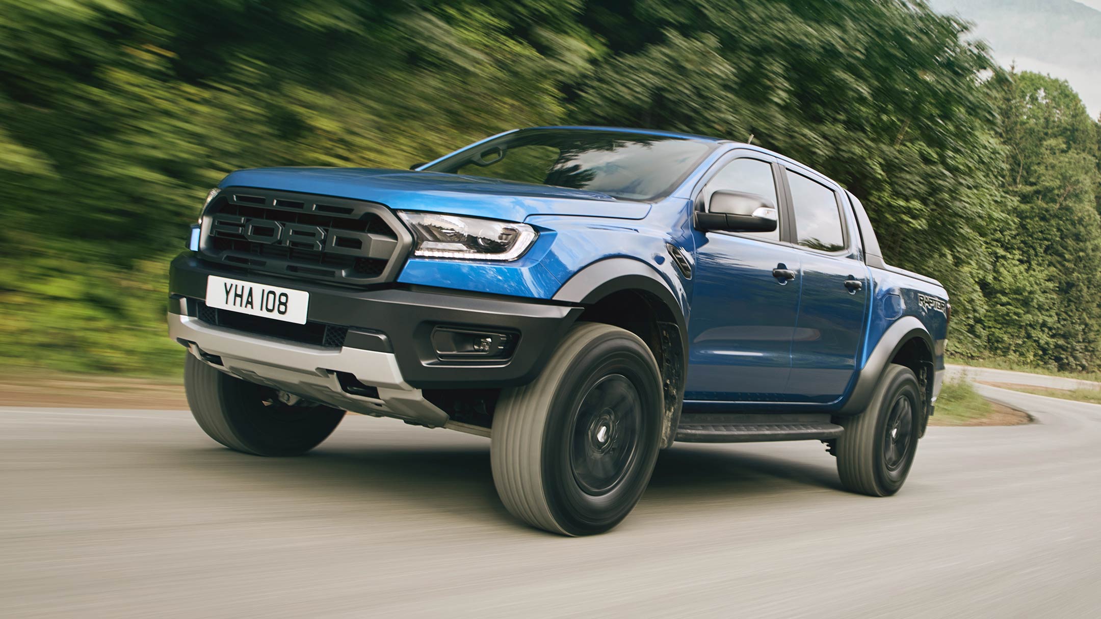 Ford Ranger Raptor driving on forest road