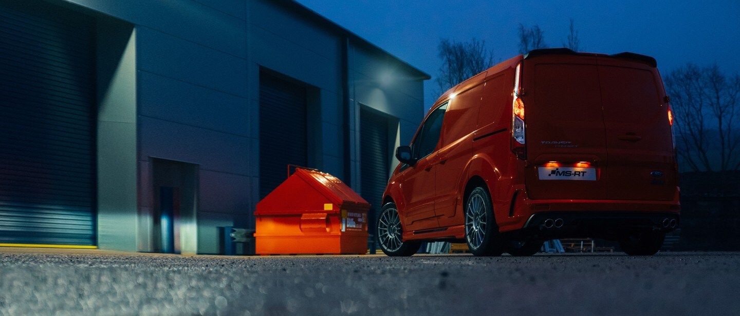 Ford Transit Connect MS-RT parked infront of a warehouse.