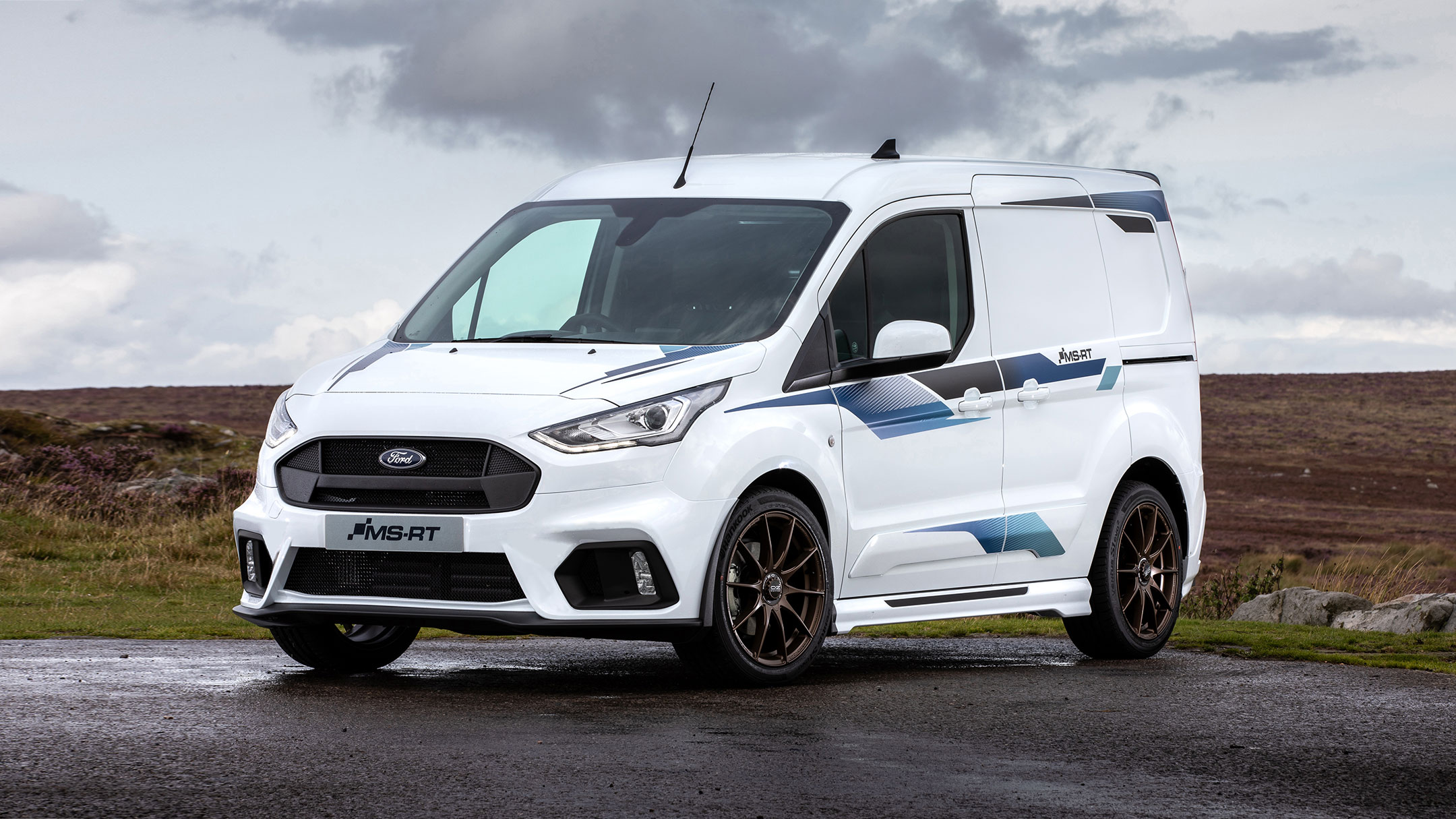 Ford Transit Custom MS-RT van in a 3-quarter view parked against a countryside background.