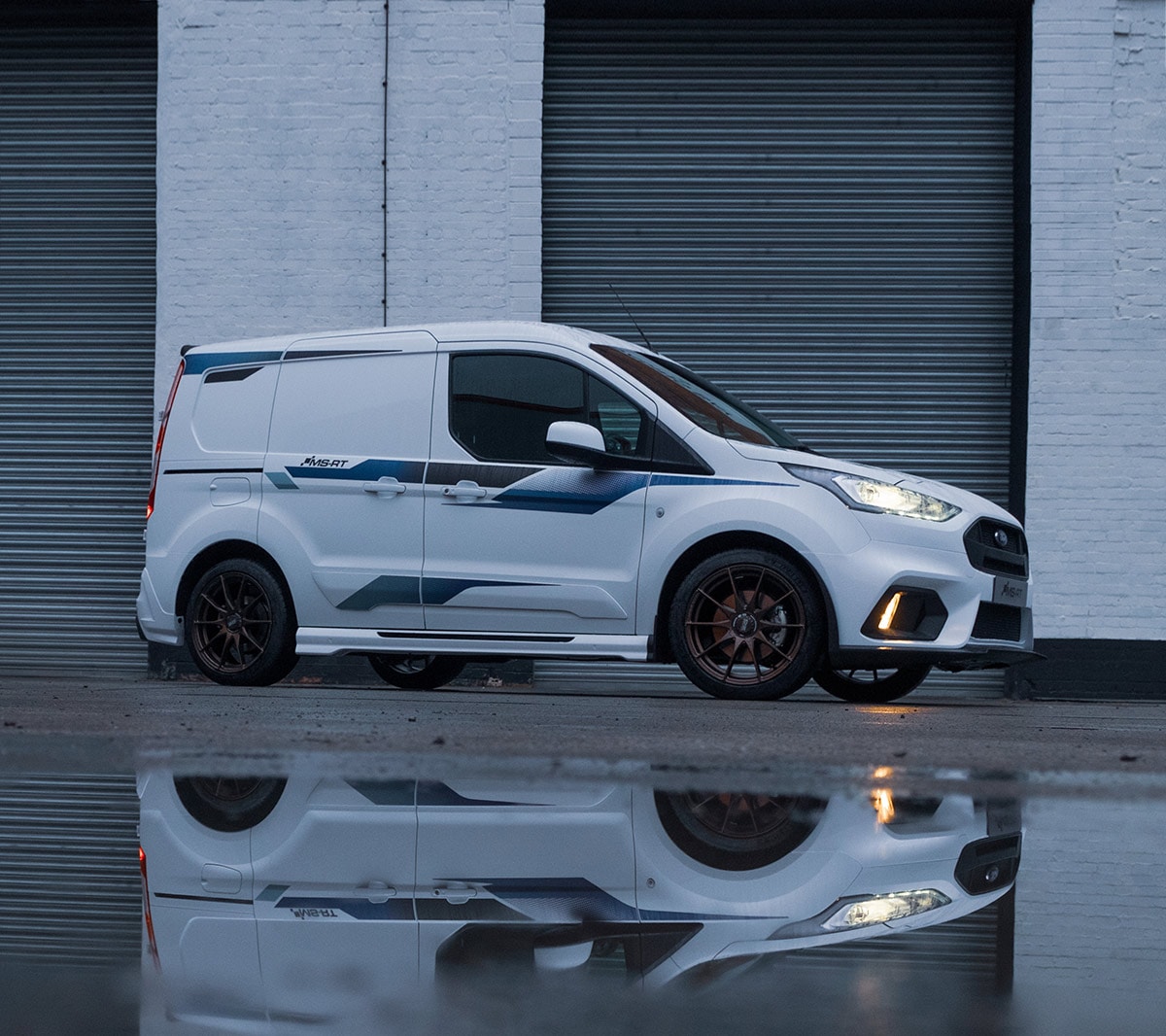 Ford Transit Custom MS-RT parked outside of a warehouse.