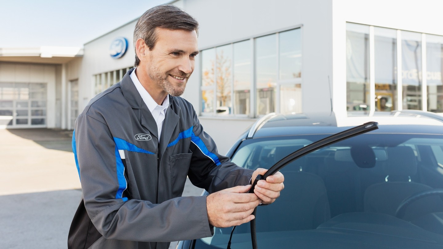 Technician installing a winscreen wiper