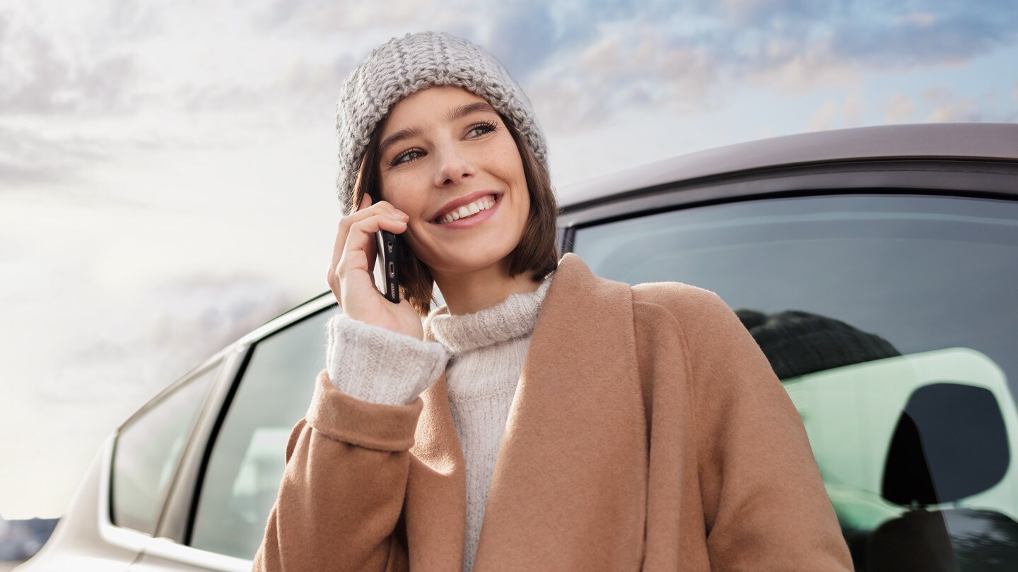 Person talking on a phone while smiling